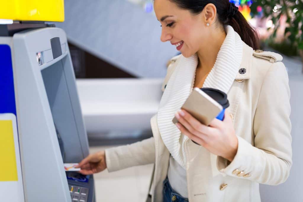 Woman using an ATM Machine