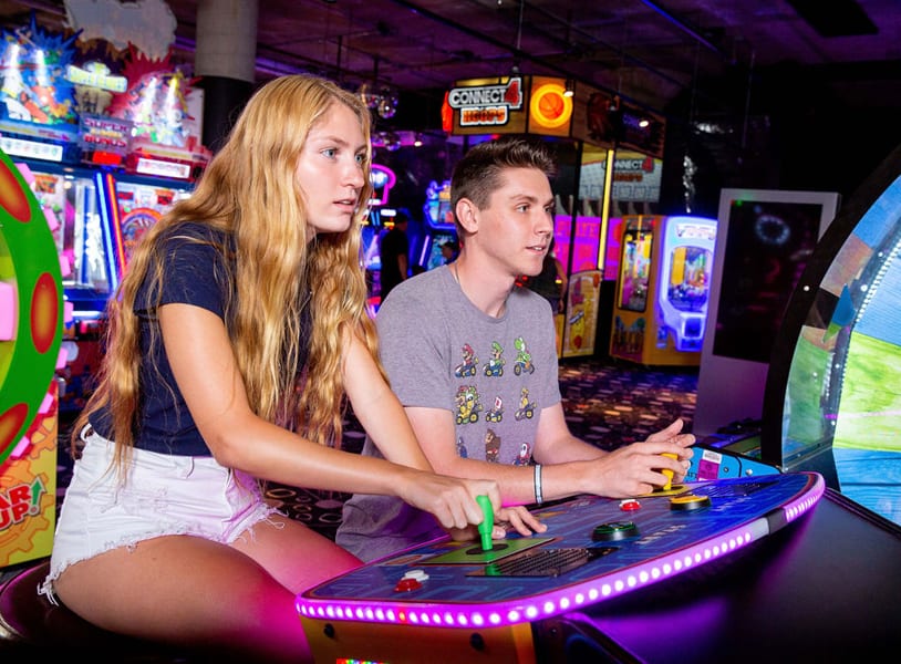 Friends Playing World's Largest Pac-Man in Arcade Game Room