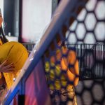 Girl playing arcade basketball
